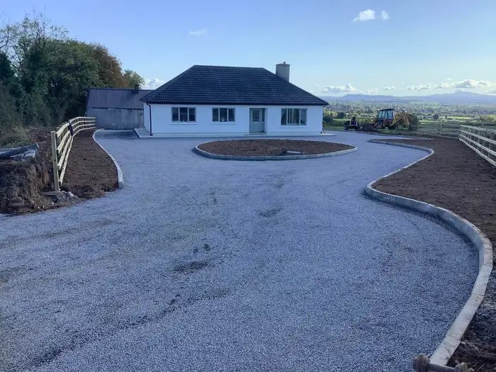 driveway and stone edging installed at the front of a house